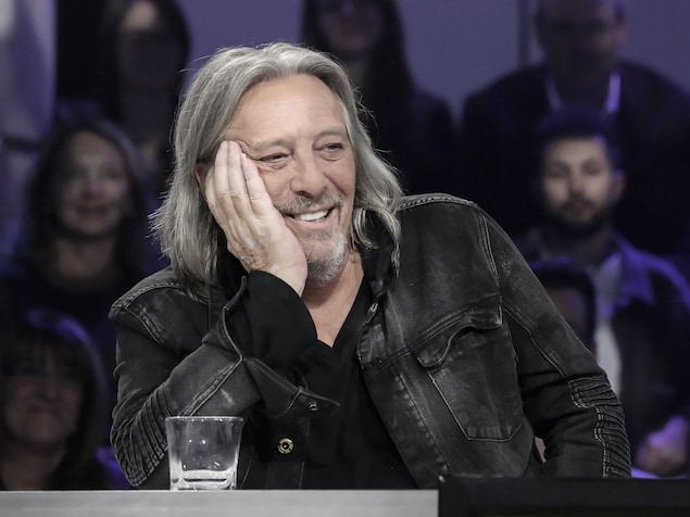 Fiori laughs, his head pressed on his right hand.