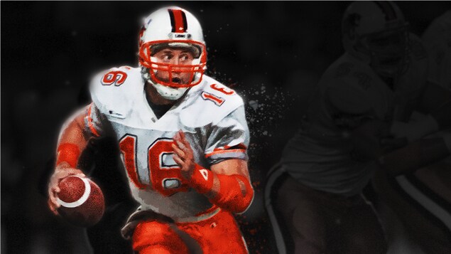 Matt Dunigan en action avec le ballon de football en main Matt Dunigan en action avec le ballon de football en main