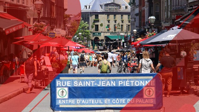 Le panneau de rue piétonne avec plusieurs piétons dans le milieu de la rue.