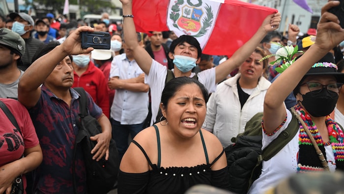 Supporters of Peruvian former President Pedro Castillo protest in the outskirts of the Lima Prefecture, where Castillo is under detention, in Lima, on December 7, 2022. - Peru's President Pedro Castillo dissolved Congress on December 7, 2022, announced a curfew and said he will form an emergency government that will rule by decree, just hours before the legislature was due to debate a motion of impeachment against him. (Photo by ERNESTO BENAVIDES / AFP) (Photo by ERNESTO BENAVIDES/AFP via Getty