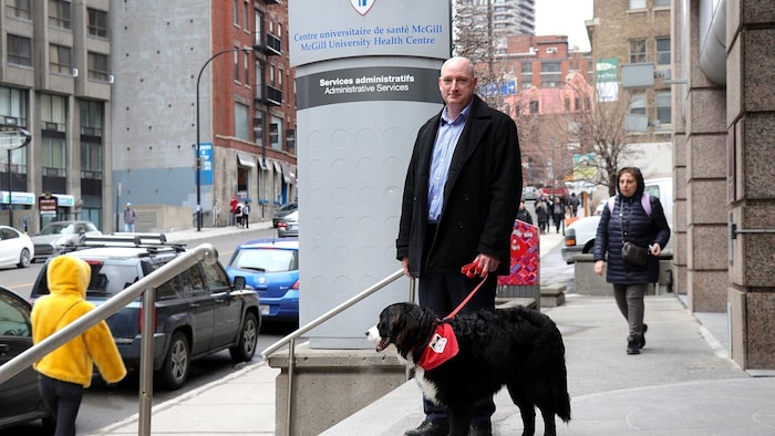 A man with a service dog.