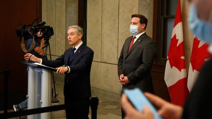 Minister of Innovation, Science and Industry François-Philippe Champagne and Minister of Public Safety Marco Mendicino hold a press conference in Ottawa on May 19, 2022. A House of Commons committee is looking to question both ministers about the effect of Chinese technology and equipment on Canada's national security.