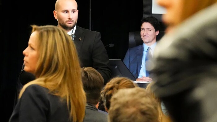 Tamara Lich, front left, returns following a break as Prime Minister Justin Trudeau waits for questioning to start as he appears as a witnesses at the Public Order Emergency Commission in Ottawa, on Friday, Nov 25, 2022.