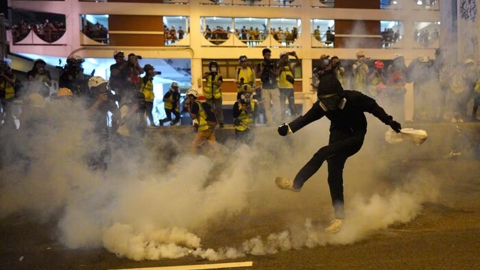Old intelligence reports accused Beijing of using criminal triads to do their dirty work outside mainland China. In one recent example, criminal groups are suspected of beating pro-democracy protesters in Hong Kong, seen here in 2019. (Ming Ko/AP)