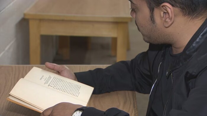 Rafid Khan burns the midnight oil almost every day - if he's not going to his second job, he's in the library studying. (Chelsea Jacobs/CBC)