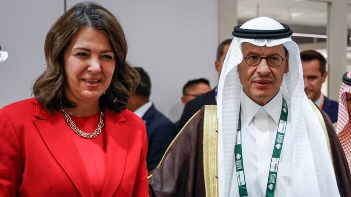Alberta Premier Danielle Smith, left, tours the Saudi Arabia pavilion with Saudi Arabia Minister of Energy Abdulaziz bin Salman Al Saud at the World Petroleum Congress in Calgary Monday. (The Canadian Press)