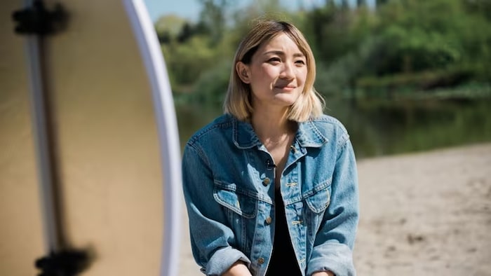 Cartoonist and illustrator Zoe Si, pictured at Trout Lake in Vancouver, B.C., says she exhausted herself trying to measure up to the model minority myth. 