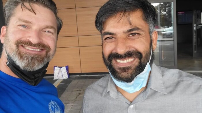 Azizi, right, took this photo with Martin after arriving in Canada.