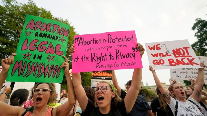Abortion rights supporters protest at the Mississippi Capitol, in Jackson, Miss., on June 28 after the U.S. Supreme Court overturned Roe v. Wade, ending constitutional protections for abortion. Mississippi has a trigger law to ban abortion that could come into effect this week, pending a legal challenge.