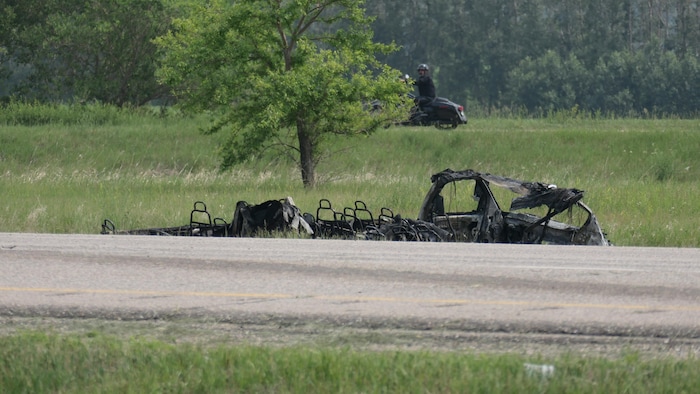A paratransit vehicle catches fire on the Trans-Canada Highway near Carberry in southwestern Manitoba on June 15, 2023. 