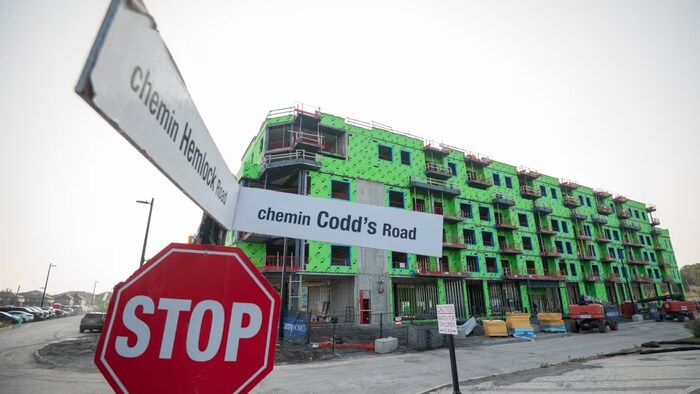 An affordable housing construction project in Ottawa is shown earlier this month. While new projects are breaking ground, it's not happening at a quick enough pace, Canada's national housing agency says. 