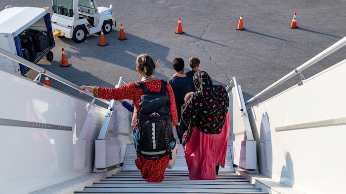 Afghan refugees who supported Canada's mission in Afghanistan arrive at Toronto Pearson International Airport in Canada on Aug. 24, 2021. 