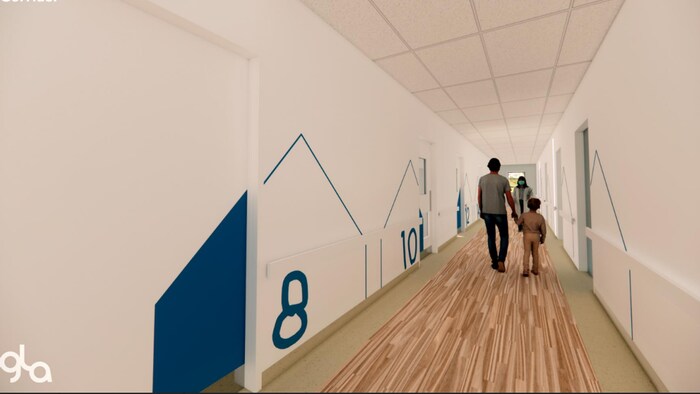 La photo d'une maquette illustrant un corridor menant à des chambres d'hôpital d'une unité pour jeunes patients.  