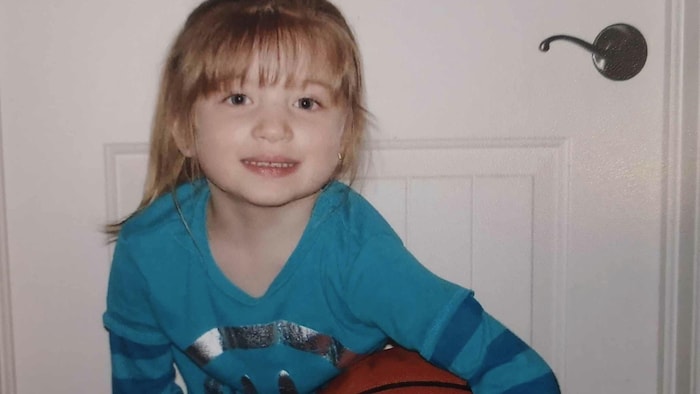 A child with a basketball.