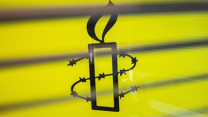 Amnesty International logo.