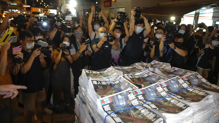 FILE - Copies of the last issue of Apple Daily arrive at a newspaper booth in Hong Kong on June 24, 2021. When the British handed its colony Hong Kong to Beijing in 1997, it was promised 50 years of self-government and freedoms of assembly, speech and press that are not allowed Chinese on the Communist-ruled mainland. As the city of 7.4 million people marks 25 years under Beijing's rule on Friday, those promises are wearing thin. Hong Kong's honeymoon period, when it carried on much as it alway