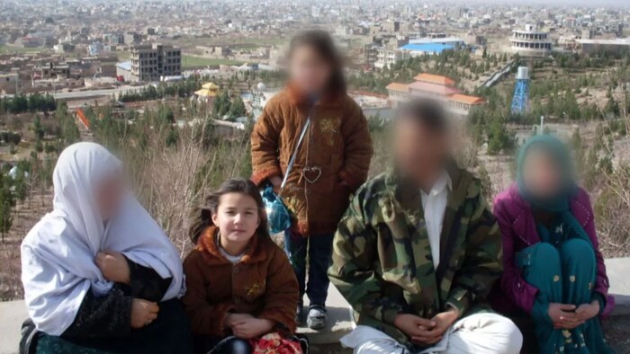 Arifa with her family in Afghanistan. Her family belongs to the Hazara ethnic minority group, who have faced discrimination because they belong to the Shia sect. (Dillon Hodgin/CBC)