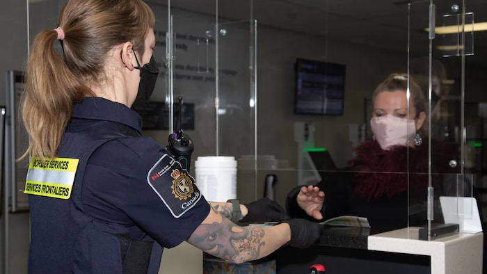 A passenger arrives at a CBSA kiosk at Macdonald–Cartier International Airport in Ottawa on January 13, 2022.