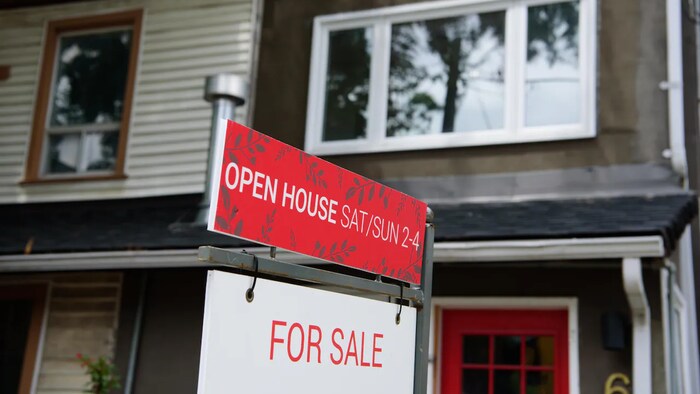 A house for sale in Toronto on Feb. 15. Rogers said rising interest rates and falling house prices are hurting more mortgage holders.