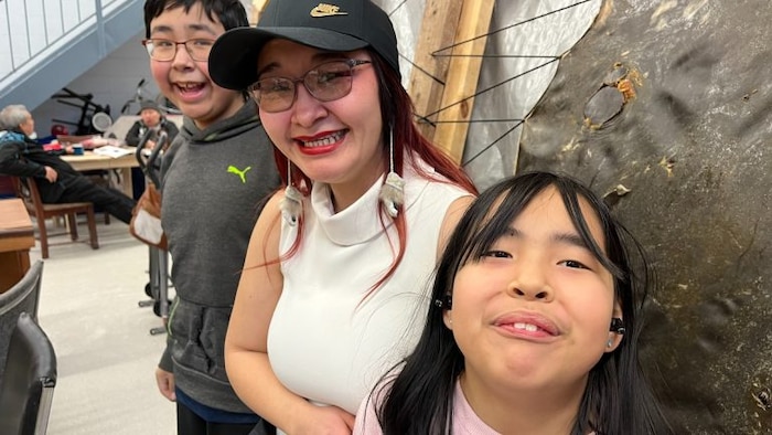 “My kids are growing up in Ottawa so they didn’t have the experience I did growing up. But coming here, they can play and hang out and they’ve already started to ask questions about what certain tools are for and the meaning behind things,” said Christine Awa, now also a worker at Isaruit, pictured here with her children Max, 12, and Raina, 9. 