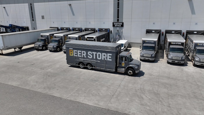 A Beer Store truck leaves parking.