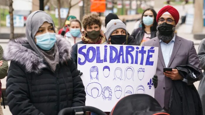 People take part in a demonstration following a Superior Court ruling on Bill 21, Quebec's secularism law, in Montreal on Tuesday, April 20, 2021.