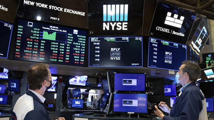 Traders working on the trading floor at the New York Stock Exchange were encouraged by last week's fall in the U.S. inflation rate, sending markets sharply higher. 