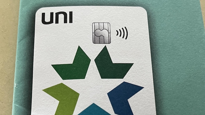 A debit‌ card showing the⁤ UNI logo.