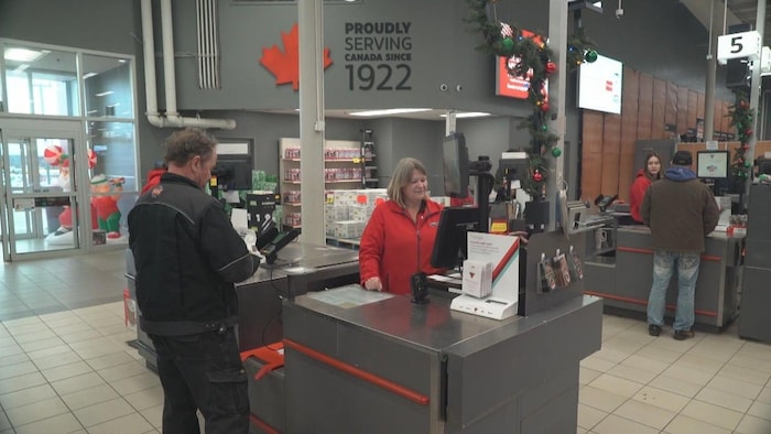 A cashier with a client at a Canadian Tire store.