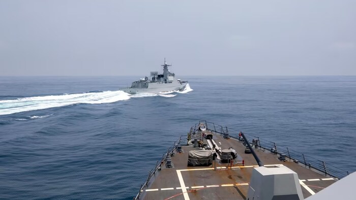 In this photo provided by the U.S. Navy, the USS Chung-Hoon observes a Chinese navy ship conduct what it called an "unsafe” Chinese maneuver in the Taiwan Strait on June 3, 2023, in which the Chinese navy ship cut sharply across the path of the American destroyer, forcing the U.S. ship to slow to avoid a collision. (Mass Communication Specialist 1st Class Andre T. Richard/U.S. Navy/The Associated Press)