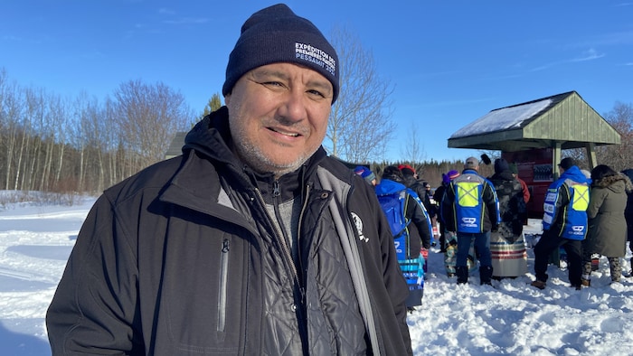 Christian Flamand sourit à la caméra.