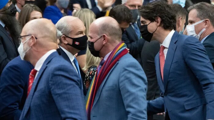 Justice Minister David Lametti, Tourism Minister Randy Boissonnault and Prime Minister Justin Trudeau crossed the floor to shake hands with Conservative MPs, including party leader Erin O'Toole following the vote.