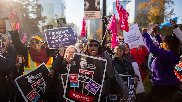 CUPE members and supporters rally outside Queen's Park in Toronto on Friday. If you predict inflation will stay high, expect more labour disputes as wage-earners struggle to catch up. (Carlos Osorio/CBC)