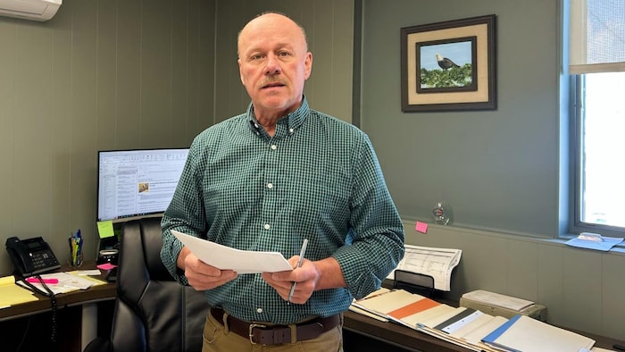 David Daigle in his office, the table of a white eagle. 