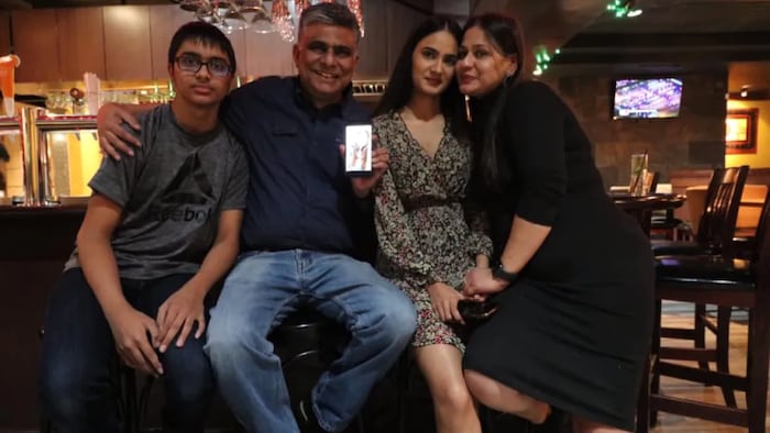Deepak Talwar, second from left, said the delays in getting permanent residency for his family meant he has not seen his eldest daughter, working in the U.S., in person for almost two years now. 