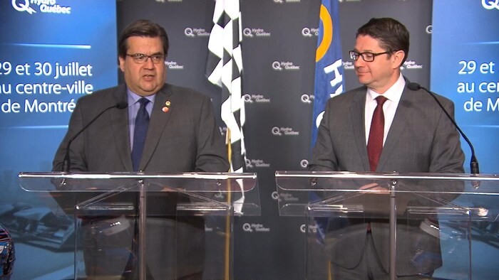 Le maire Denis Coderre et le PDG d'Hydro-Québec, Éric Martel, lors d'une conférence de presse au sujet de la course de formule E à Montréal.