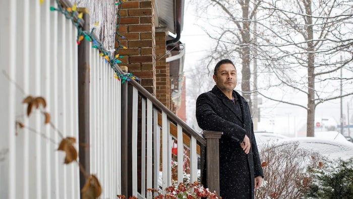 Sajid Qureshi, who bought a townhouse in Collingwood, Ont., only to have the developer come back for more money, is pictured at his home in Toronto on Dec. 8, 2021. 