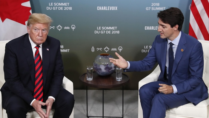 Donald Trump makes an awkward scowl while addressing Justin Trudeau.