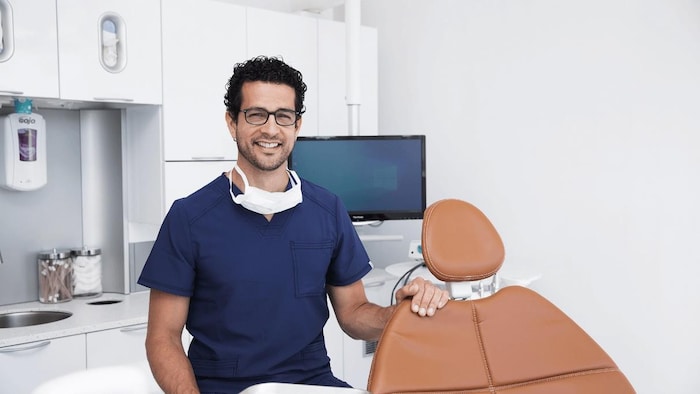 Doctor Jason Battah in an exam room.