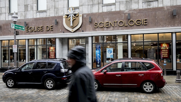 A man walks in front of the Church of Scientology in Quebec