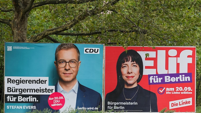 Les pancartes électorales de deux candidats.