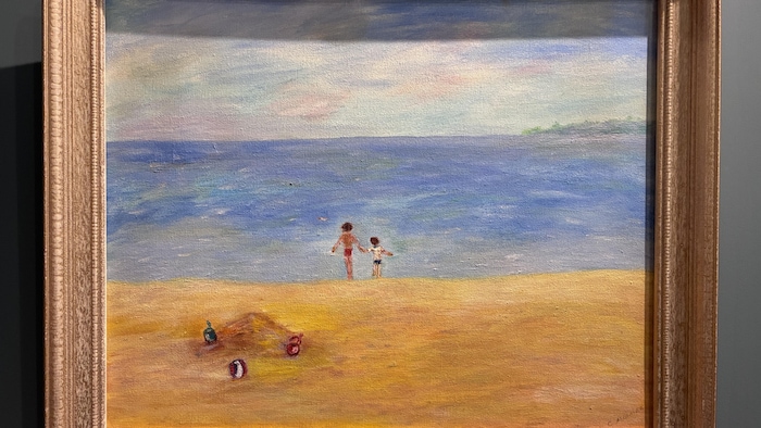 Un tableau représentant deux enfants sur une plage.
