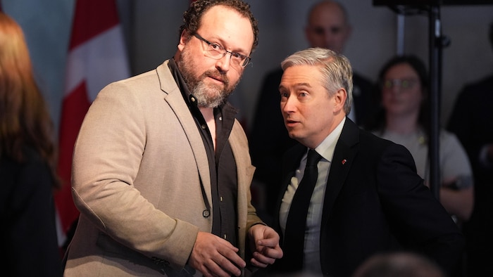 François-Philippe Champagne en compagnie Flavio Volpe, à Toronto, le 7 février 2025.