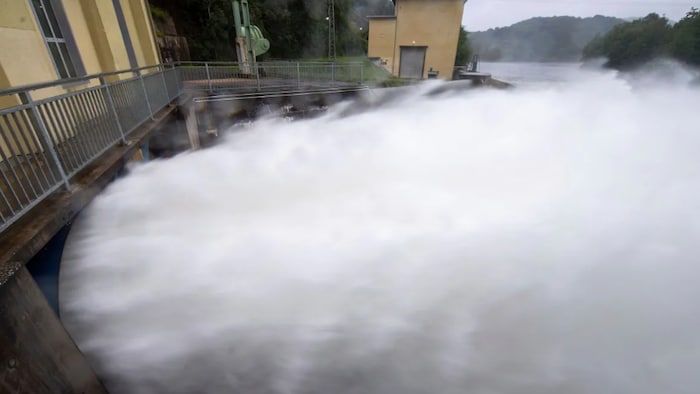 Water shoots out of the outlet of the hydroelectric power station below the Ruhr dam near Heimbach, Germany, on Friday.