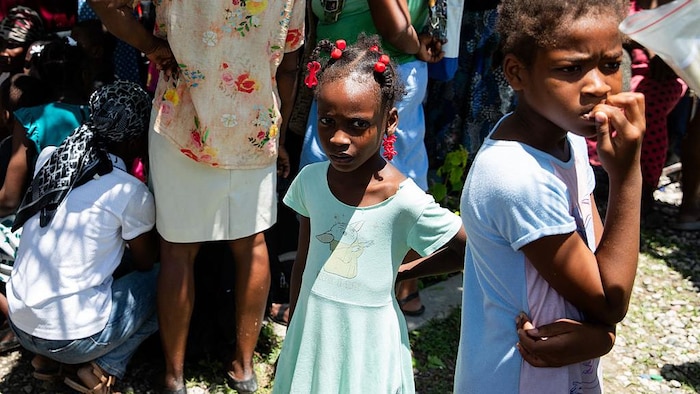 The children watch the residents leave, filled with fear.