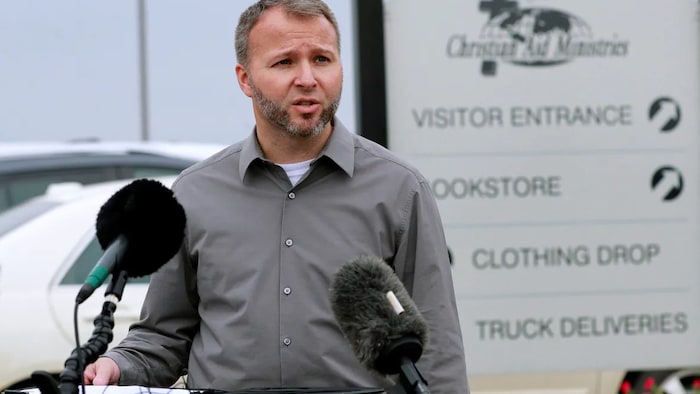 Weston Showalter, spokesperson for Christian Aid Ministries, speaks to the media at a news conference in Millersburg, Ohio, on Thursday.