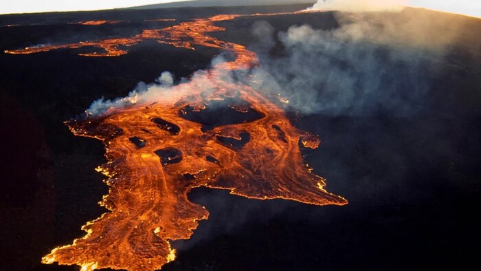 The Mauna Loa volcano on the island of Hawaii is shown a March 25, 1984, handout photo provided by the U.S. Geological Survey, and released to Reuters in 2014. Scientists had been on alert for new activity because of a recent spike in earthquakes at the summit of the volcano. (U.S. Geological Survey/Reuters)