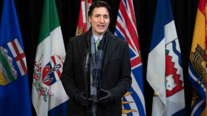 Prime Minister Justin Trudeau speaks with media as he arrives for a health care meeting with premiers on Tuesday, February 7, 2023 in Ottawa. (Adrian Wyld/The Canadian Press)
