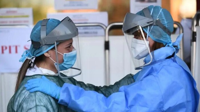 Health care workers in Edmonton in full PPE gear.