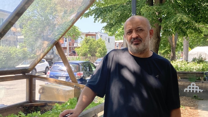 Ahmed Cherifi, a tenant of HLM La Pépinière in Montreal, in front of a public park.
